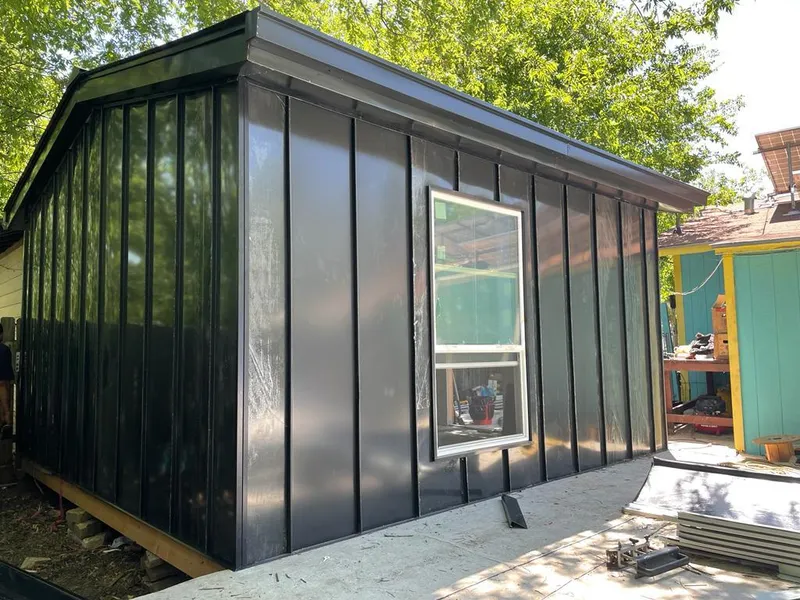 Black standing seam metal wall panels for Metal Roof Installation in Fruitport